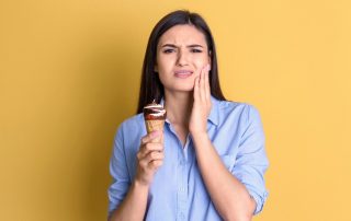 Woman with sensitive teeth
