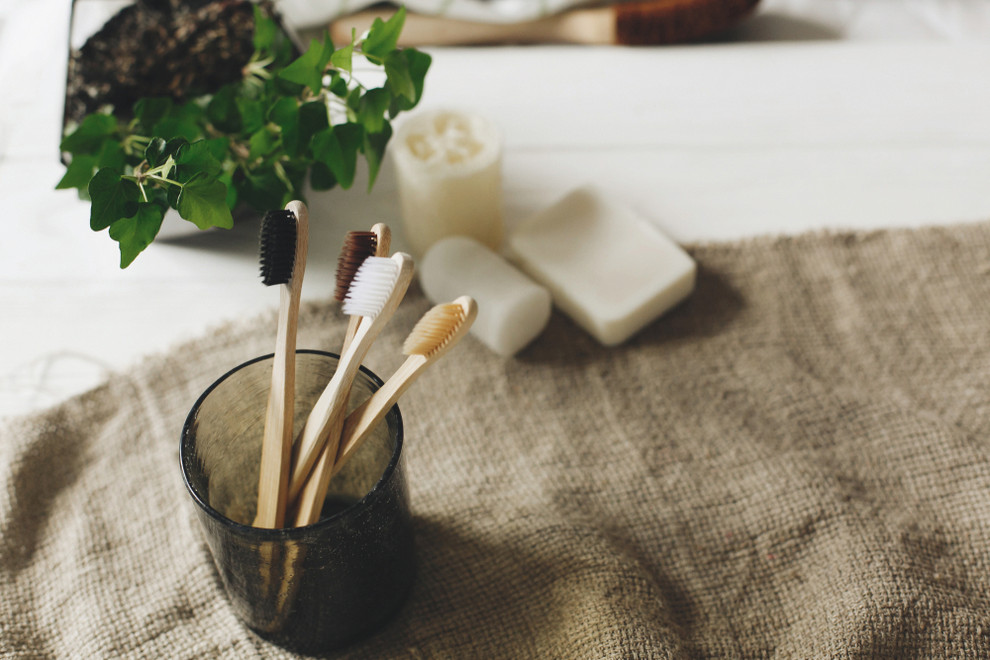 Bamboo toothbrushes in glass