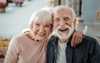 Smiling elderly couple
