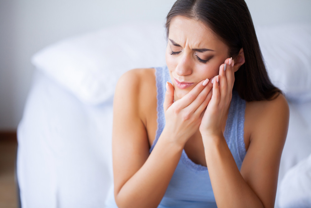 Woman in pain with root canal