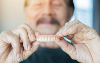 Restore Full Smiles with Seamless Denture Services at Carmichael DDS